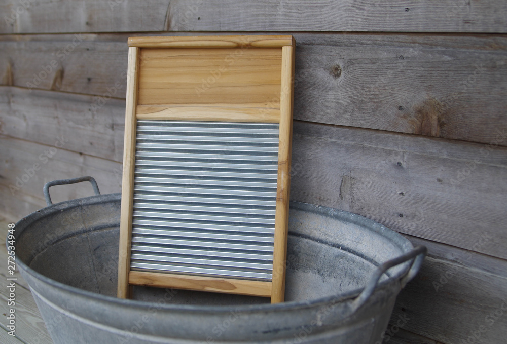 Wood and galvanized metal washboard in galvanized wash tub Stock Photo |  Adobe Stock