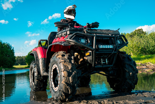 ATV in nature. Outdoor activity. Quad bike rides. Extreme sport. Forest  nature  river  field.