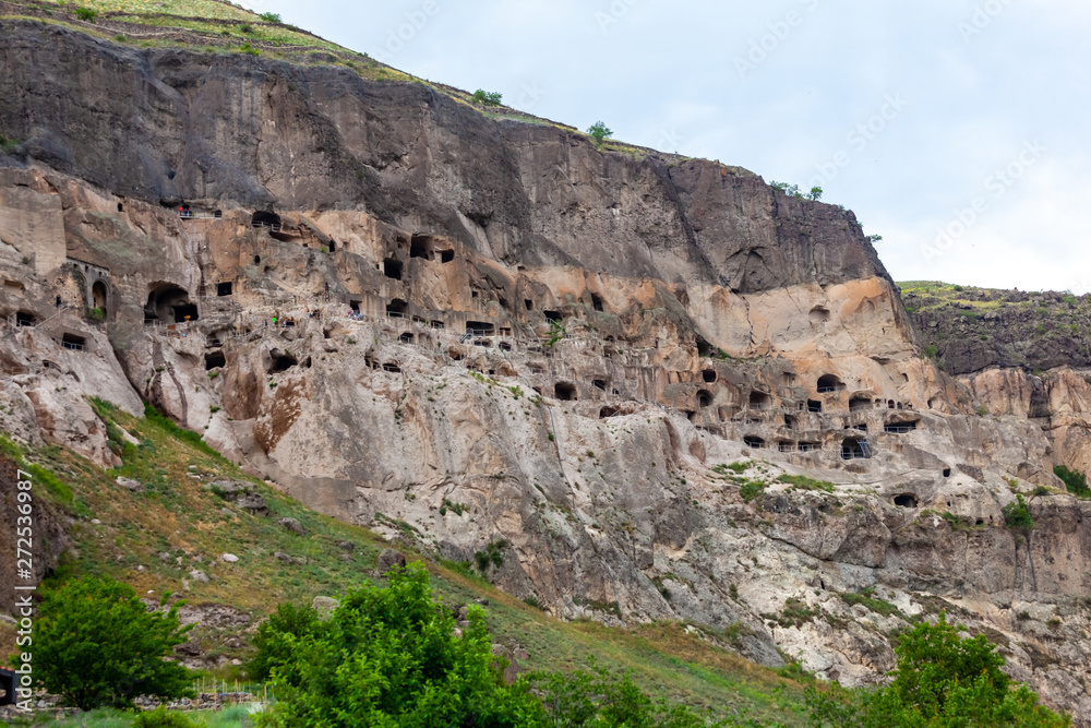 View of Vardzia caves. Vardzia is a cave monastery site in southern Georgia, excavated from the slopes of the Erusheti Mountain on the left bank of the Kura River View of Vardzia caves. Vardzia is a cave monastery site in southern Georgia, excavated from the slopes of the Erusheti Mountain on the left bank of the Kura River