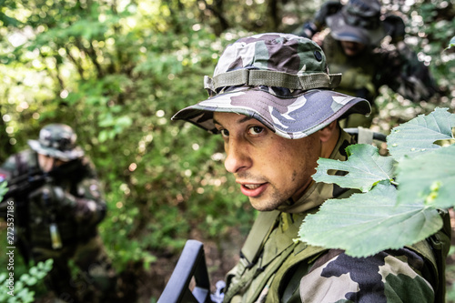 Εκτύπωση καμβά Special forces mercenary soldiers dogs of war in the forest during the combat ba