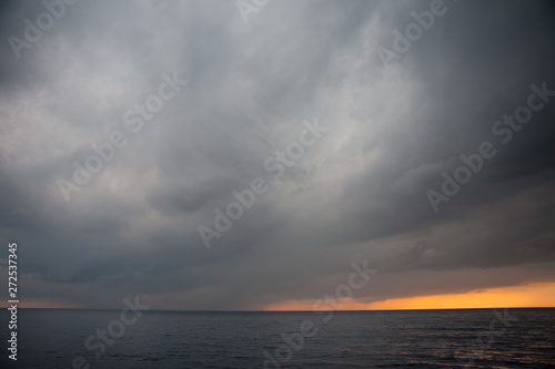 Storm clouds drift across the Pacific ocean in Komodo National Park, Indonesia. This tropical area is part of the Coral Triangle and is a popular destination for divers and snorkelers. © ead72