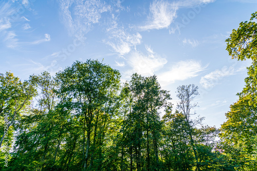 blue sky with white clouds over countryside landscape