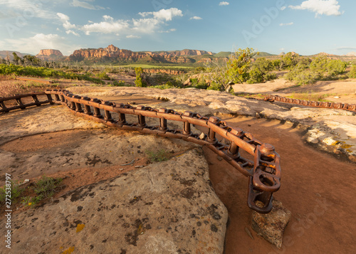The track from an old farm tractor is draped across the slickrock in the mountains of the southwest desert. photo