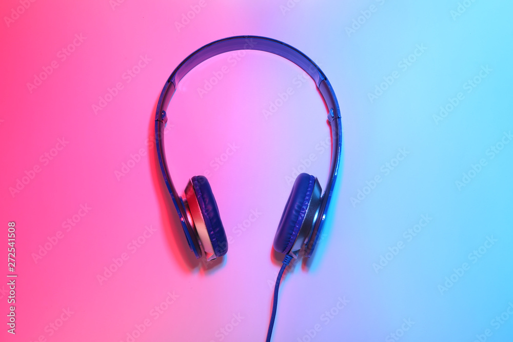 Stylish headphones on color background, top view Stylish headphones on color background, top view