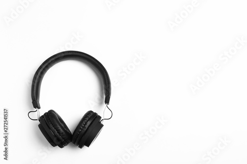 Stylish modern headphones on white background, top view