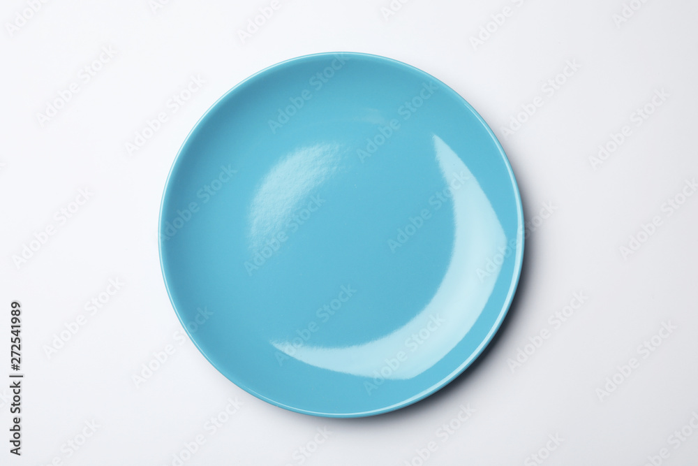 Clean empty plate on white background, top view