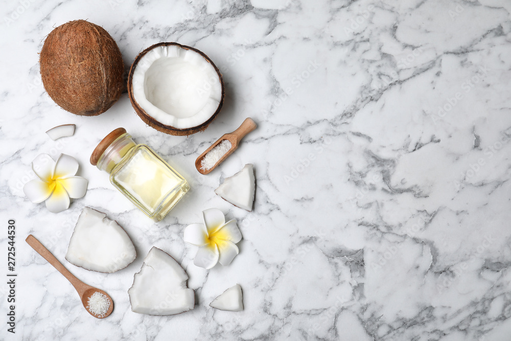 Flat lay composition with natural organic coconut oil on marble background. Space for text Flat lay composition with natural organic coconut oil on marble background. Space for text