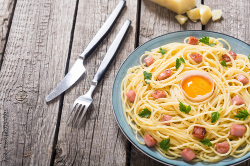 Itslian pasta carbonara with sausage and egg photo