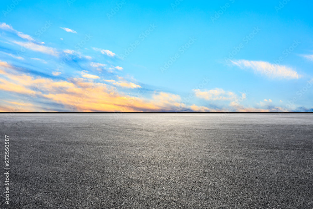 Fototapeta premium Empty asphalt race track and sunset sky