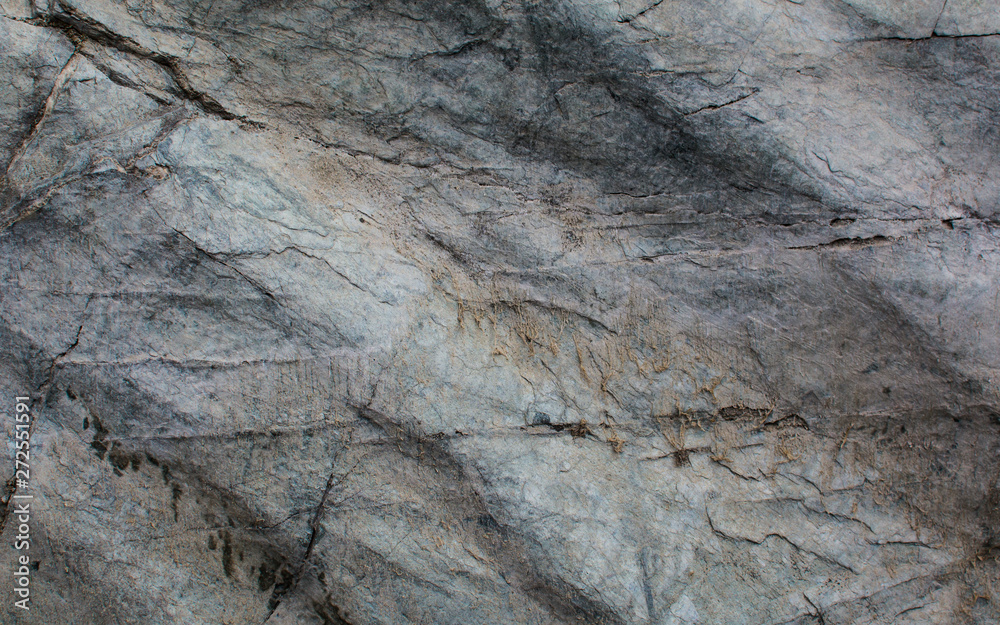 The texture of the stone. Light background. Relief surface