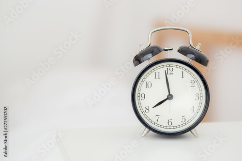 closeup alarm clock and beautiful asian young woman in morning, wake up for sleep with alarm clock, relax and lifestyle concept.