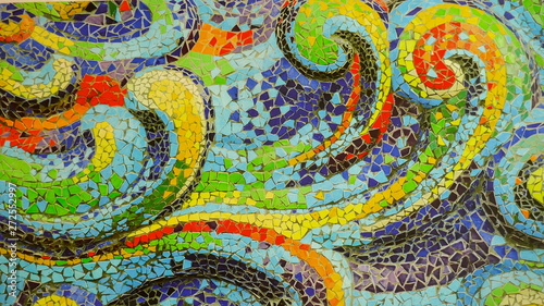 Detail of a colorful mosaic with abstract wave pattern. Close-up.