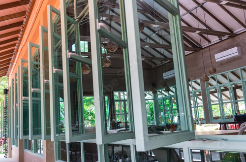 Row of windows with glass  window frame  of the airy building in the city