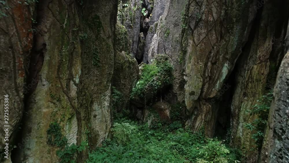Drone shot inside Shilin Stone Forest in China Drone shot inside Shilin Stone Forest in China