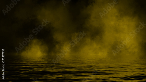 Yellow rolling billows of smoke mist clouds from dry ice across the bottom light with reflection in water. Design element.