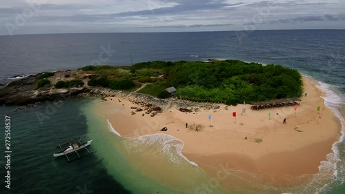 Aerial drone video of an exotic white sand tropical island in the Southeast Asia photo