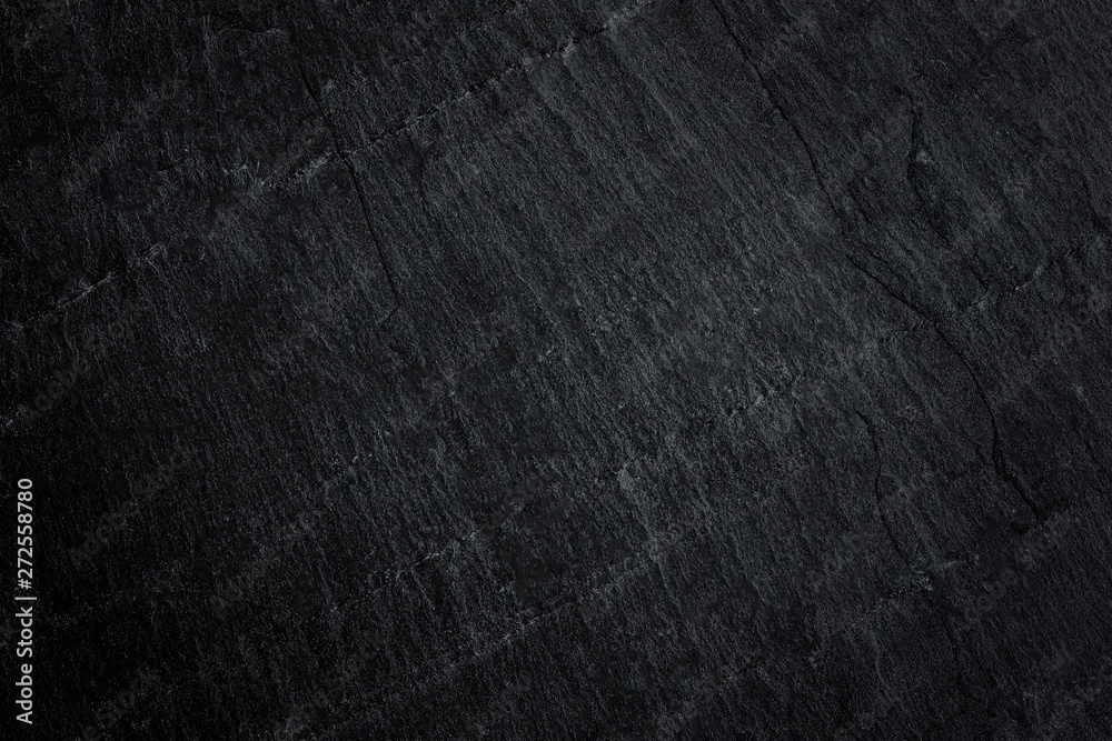 Dark grey black slate background or natural stone texture. Dark grey black slate background or natural stone texture.