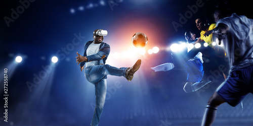 Virtual Reality headset on a black male playing soccer. Mixed Media © Sergey Nivens