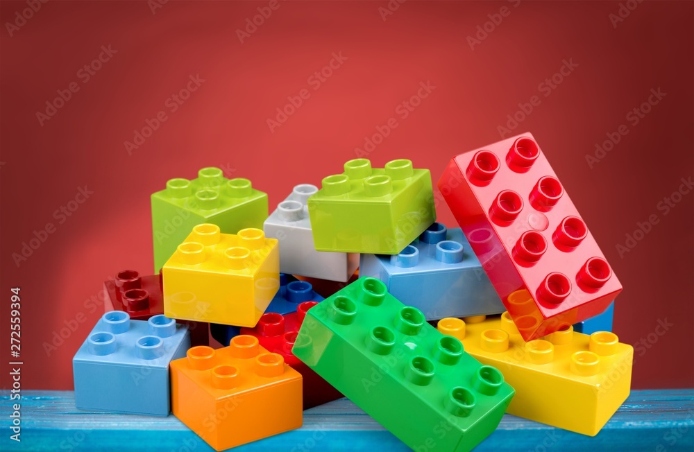 Toys collection on wooden table with blurred background