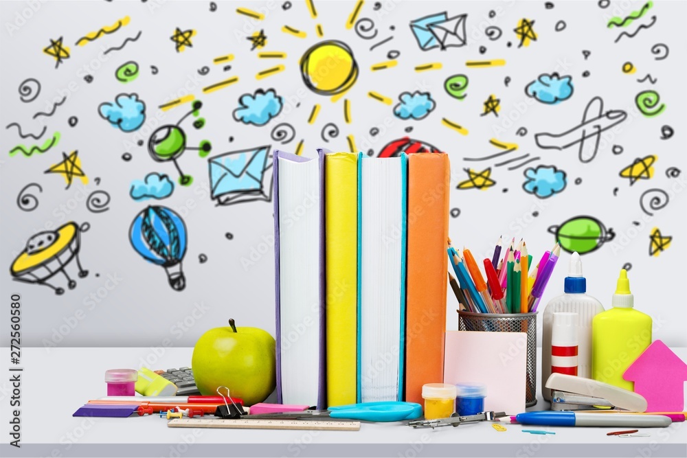 School supplies - books, pencils and apples on desk School supplies - books, pencils and apples on desk