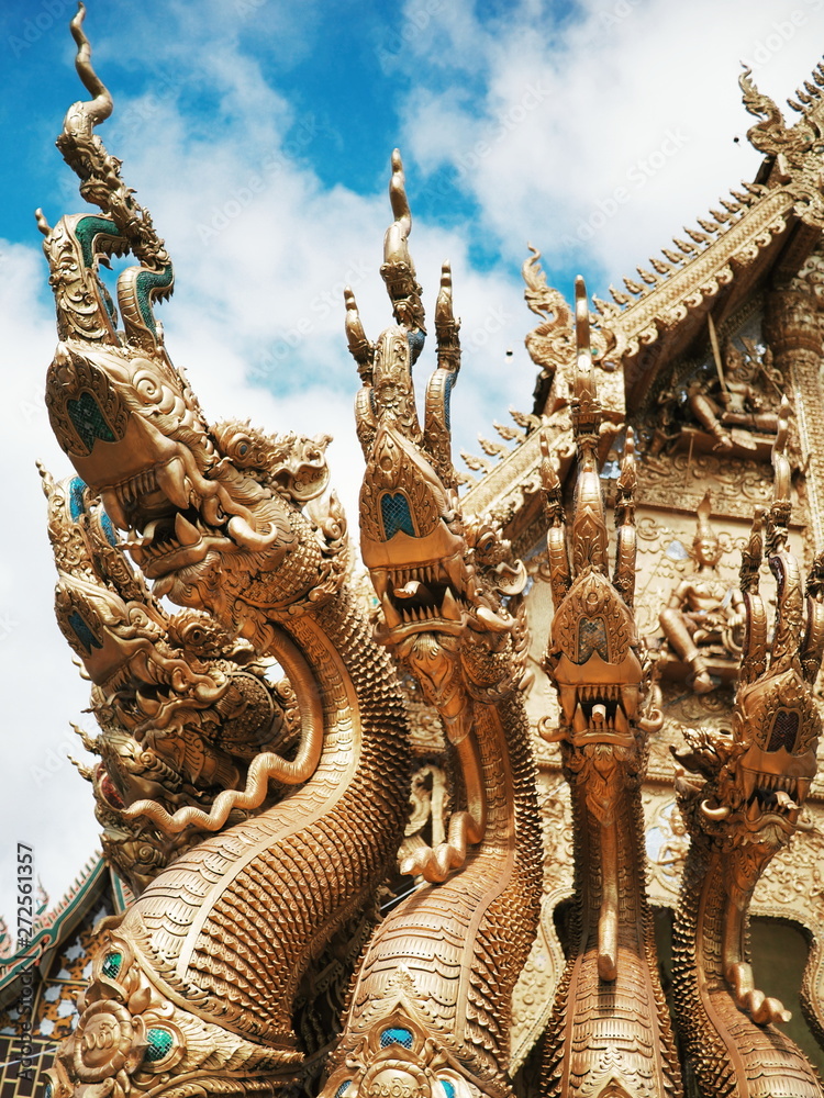 golden dragon statue in thai temple