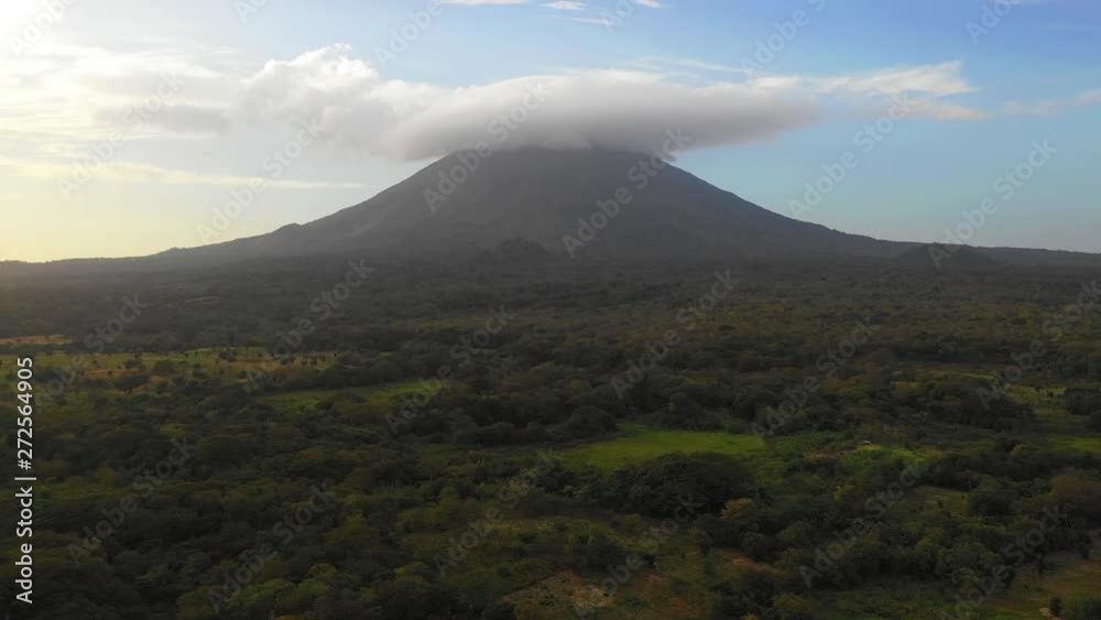 Aerial Forward/Right: Volcano In Green Valley With Smoke Above - Ometepe, Nicaragua Aerial Forward/Right: Volcano In Green Valley With Smoke Above - Ometepe, Nicaragua