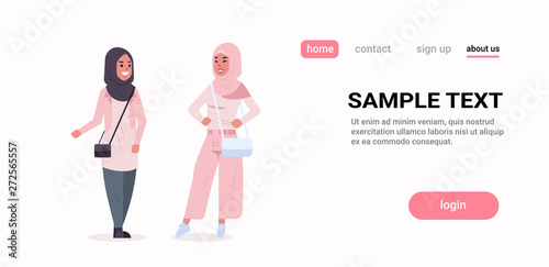 couple arabic women in hijab discussing arab girls wearing headscarf traditional clothes standing together communication concept full length horizontal copy space flat