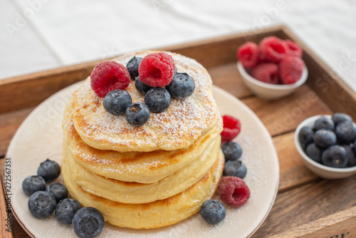 home made sweet pancakes with berries for breakfast