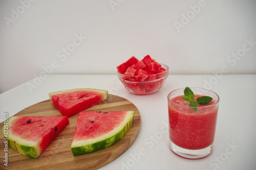 High angle view of the watermelon slices and smoothie