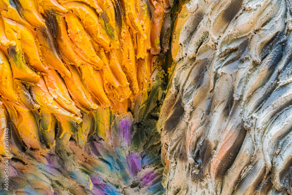 Close up to Colorful and patterns of  dinosaur model surfaces created with cement