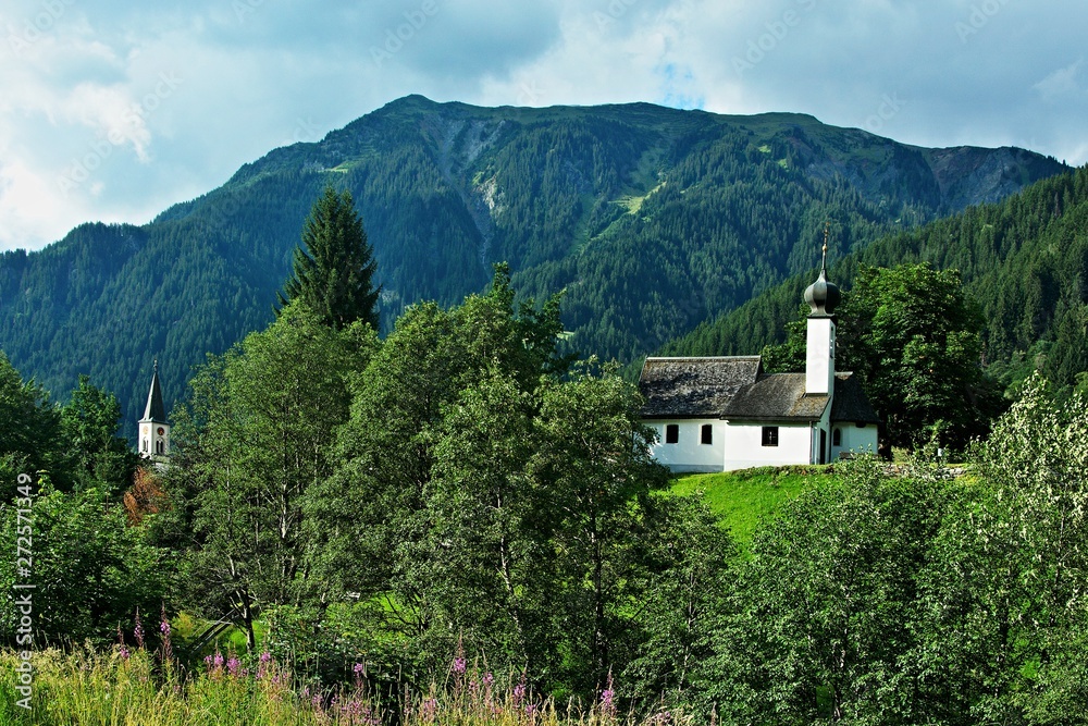 Austrian Alps-view of the church tower and chapel in town Gaschurn