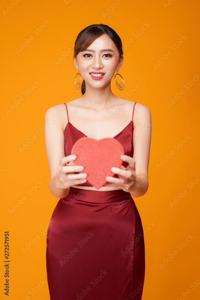 Portrait of Beautiful woman with red heart shaped box Portrait of Beautiful woman with red heart shaped box