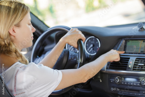 attractive woman listen radio in her car