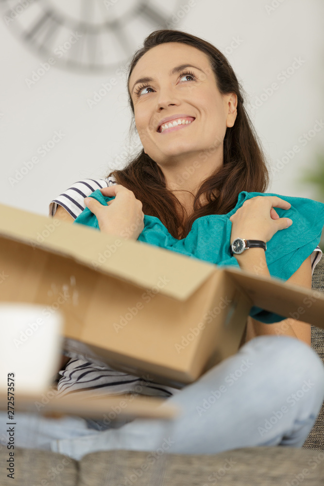 happy casual stylist showing her new t-shirt happy casual stylist showing her new t-shirt