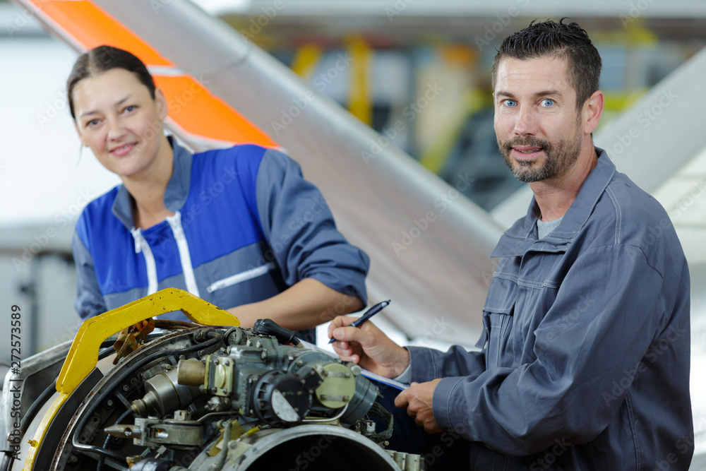 factory workers working with engine factory workers working with engine