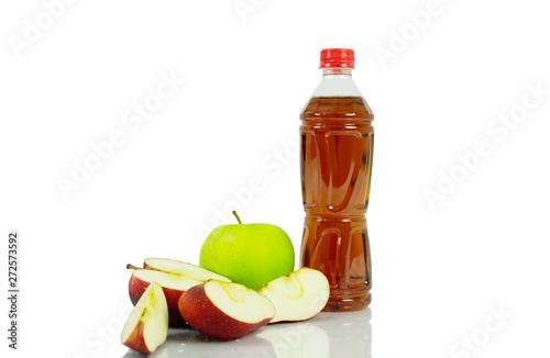 apple and bottle on white background.