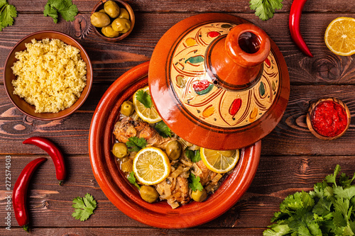 Traditional moroccan tajine of chicken with salted lemons, olives photo