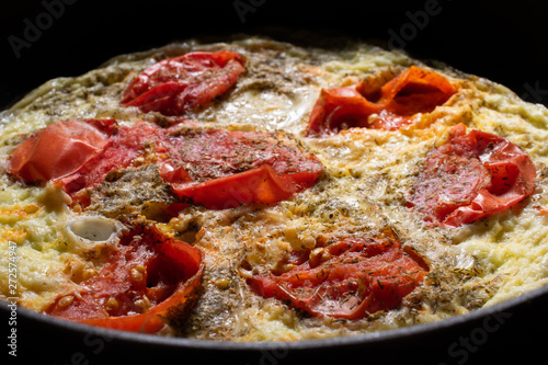 Omelette with tomatoes and greens