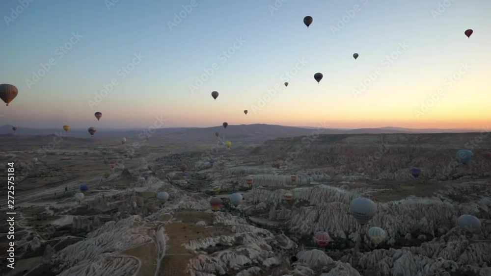 Pan of Many Hot Air Balloons Filling the Expansive Skyline - Cappadocia, Turkey Pan of Many Hot Air Balloons Filling the Expansive Skyline - Cappadocia, Turkey