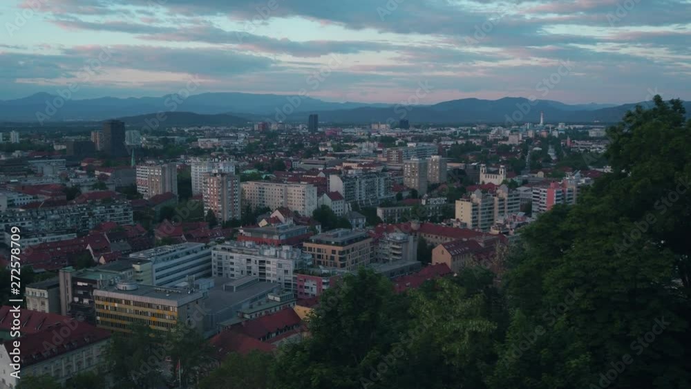 Ljubljana city panorama in the evening. Aerial view. Old town buildings and streets. Alp mountains in the back. Ljubljana city panorama in the evening. Aerial view. Old town buildings and streets. Alp mountains in the back.