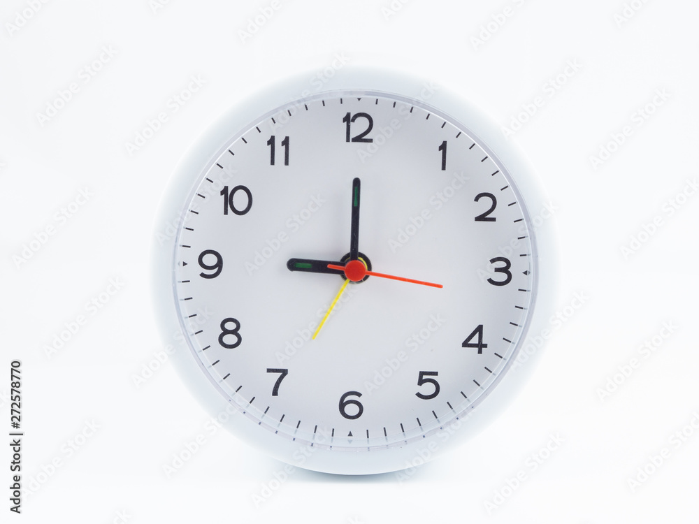 White alarm clock on white background, At nine o'clock in the morning, At three o'clock at night, The short needle is at the nine numbers and the needle is twelve numbers. White alarm clock on white background, At nine o'clock in the morning, At three o'clock at night, The short needle is at the nine numbers and the needle is twelve numbers.