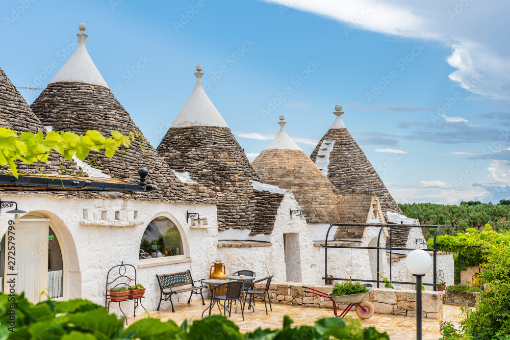 Fototapeta premium Trulli of the Itria valley. Details in the sky. Puglia, Italy.