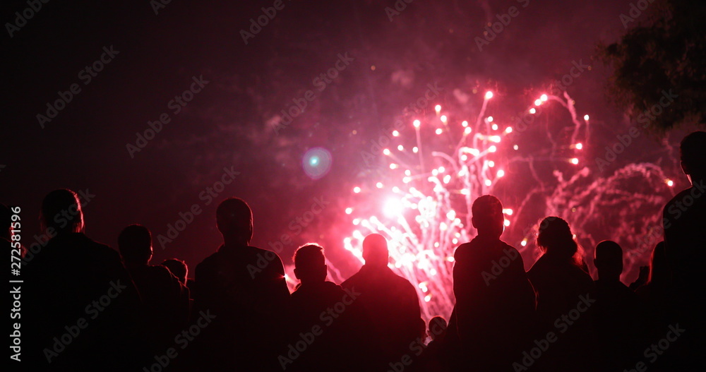 Crowd watching fireworks and celebrating new year eve