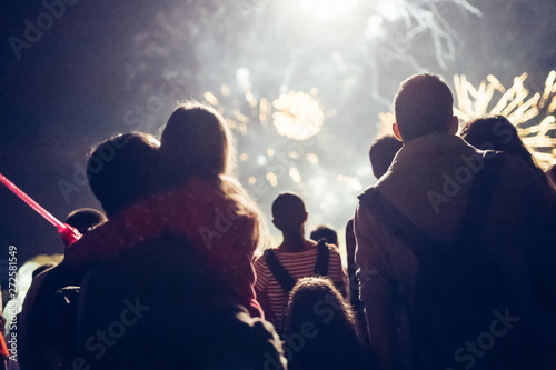 Crowd watching fireworks and celebrating new year eve