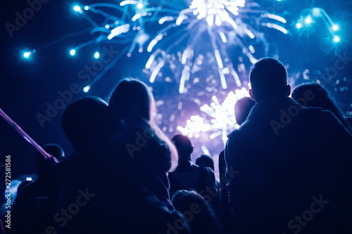 Fotografie Crowd watching fireworks and celebrating new year eve