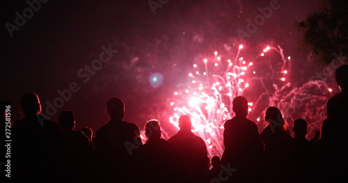 Crowd watching fireworks and celebrating new year eve