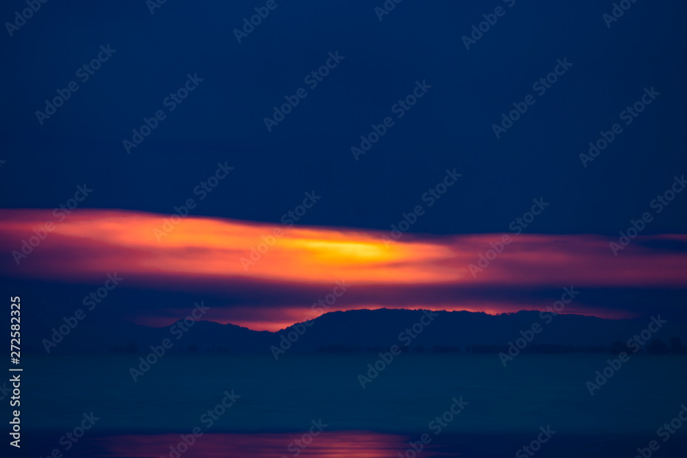 Fototapeta premium seascape of sunset sky and rain clouds