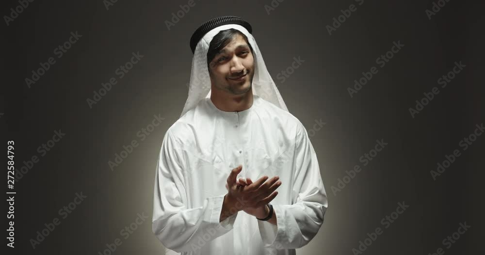 Close up shot of arab man looking at camera and happily smiling, clapping and applausing, isolated on black background slow motion 4k Close up shot of arab man looking at camera and happily smiling, clapping and applausing, isolated on black background slow motion 4k
