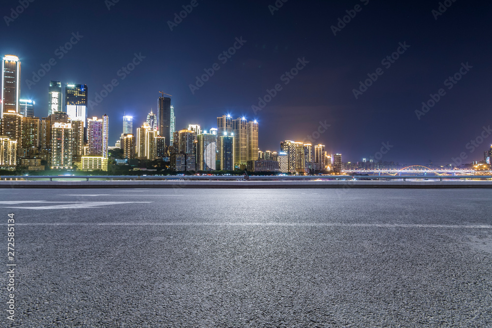 Fototapeta premium Panoramic skyline and modern business office buildings with empty road,empty concrete square floor