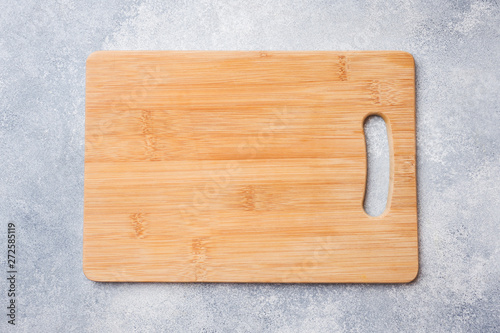 empty wooden cutting board on kitchen table. Top view copy space